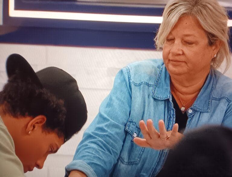 Angela let Cedric paint her nails.