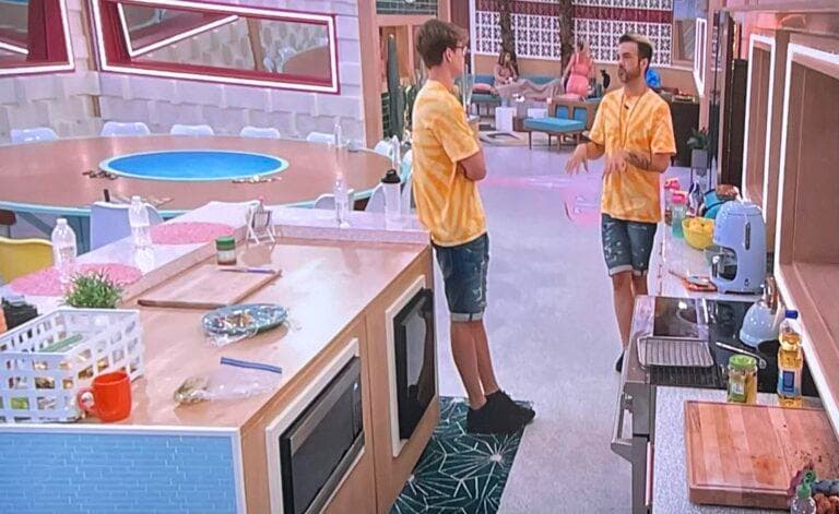 Daniel and Kyle chat in the kitchen